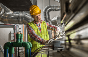 man working on an hvac unit 