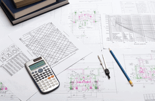 desk with paperwork and calculater on it 