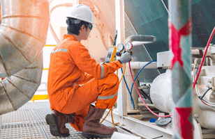 technician working on dial gage 