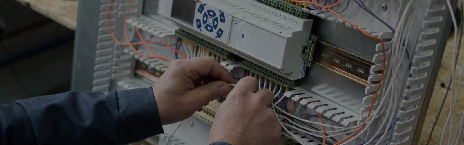 close up of hands working on hvac wiring