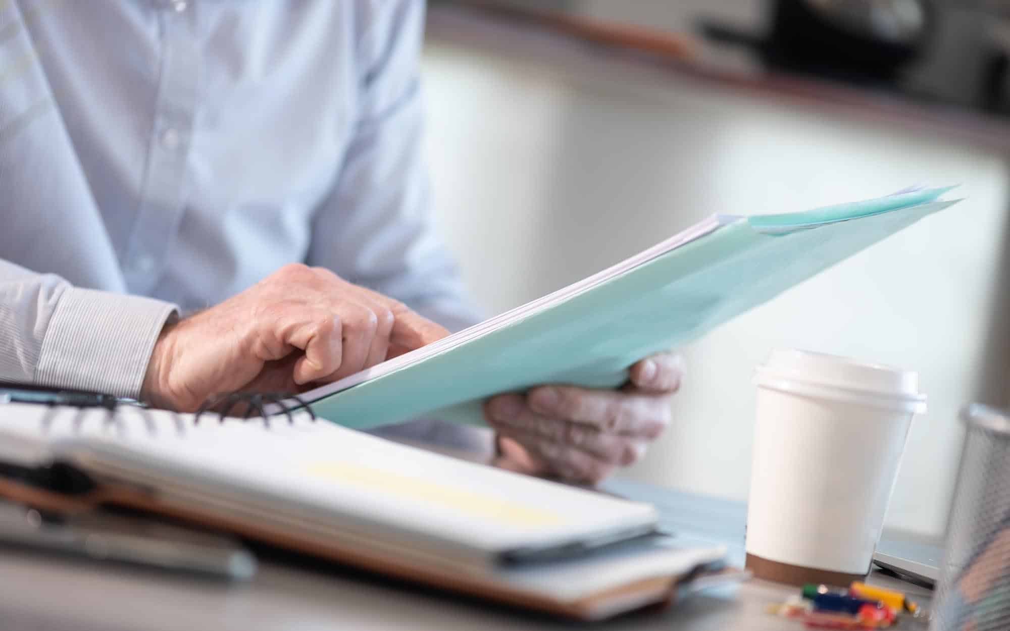 close up of scientist reading paperwork