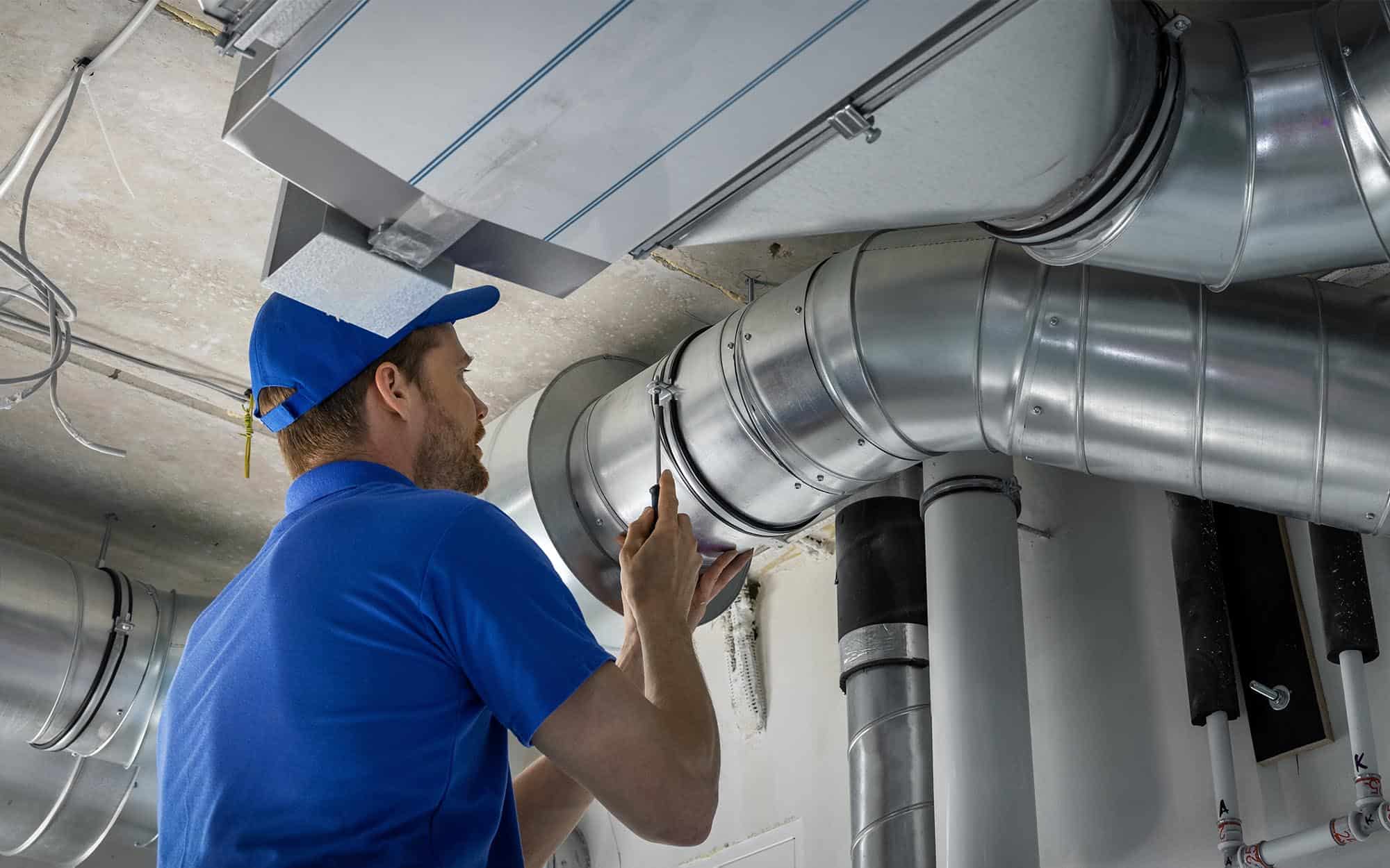 Worker Installing Hvac Ducts | React Industries